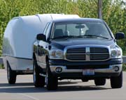 Enclosed motorcycle trailer - fuel efficient, lightweight and aerodynamic fiber reinforced plastic with an aluminum frame