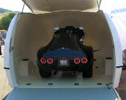 Enclosed motorcycle trailer - fuel efficient, lightweight and aerodynamic fiber reinforced plastic with an aluminum frame