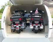Enclosed motorcycle trailer - fuel efficient, lightweight and aerodynamic fiber reinforced plastic with an aluminum frame